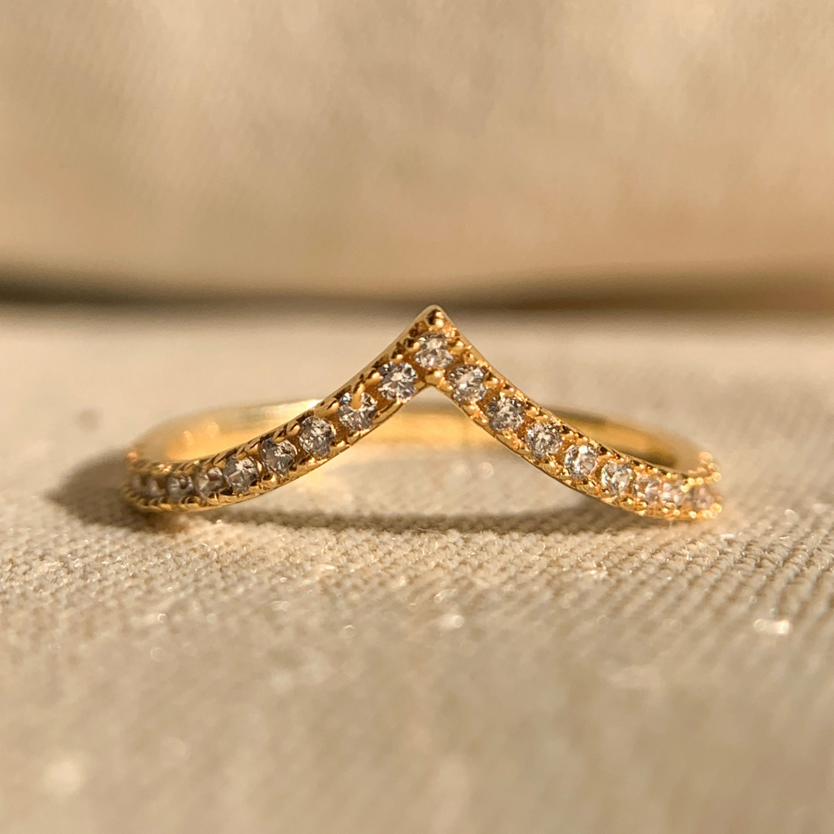 Yellow gold chevron diamond ring with minimalist V-shaped design